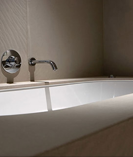 Undermounted bath Surround And wall cladding floor to ceiling